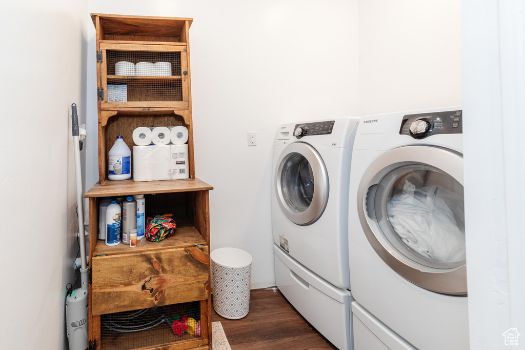Laundry room featuring separate washer and dryer and dark wood-style floors