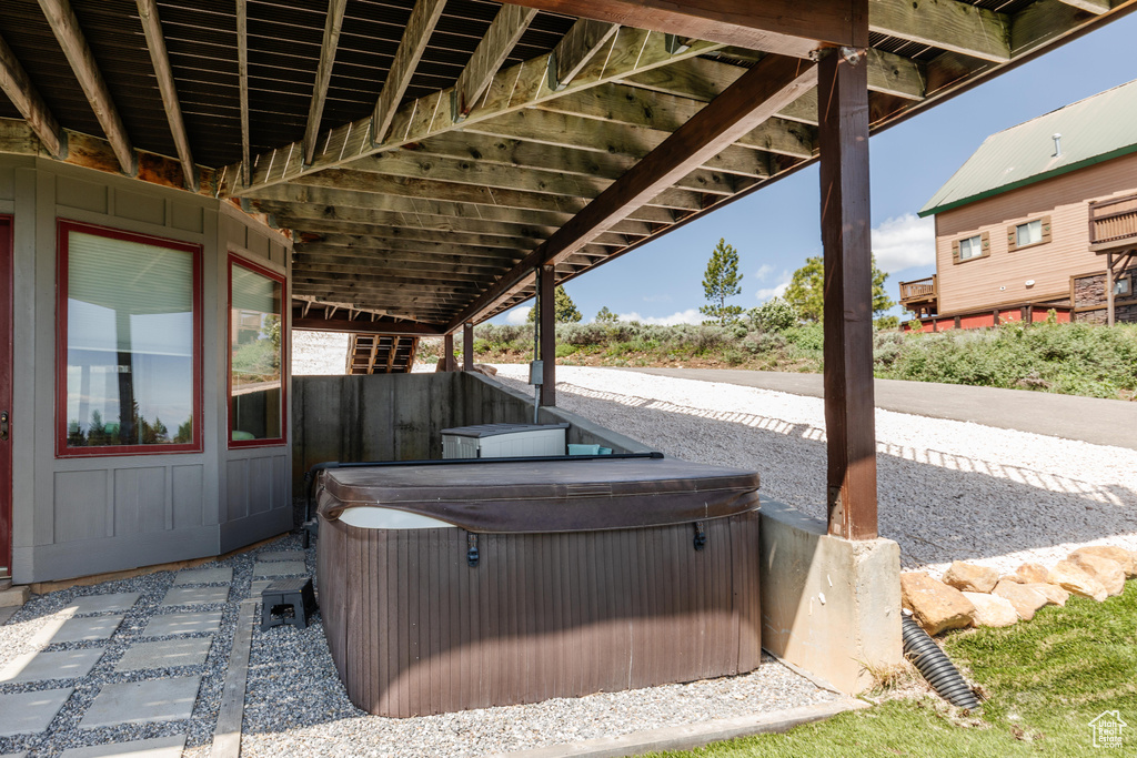 View of patio / terrace featuring a hot tub