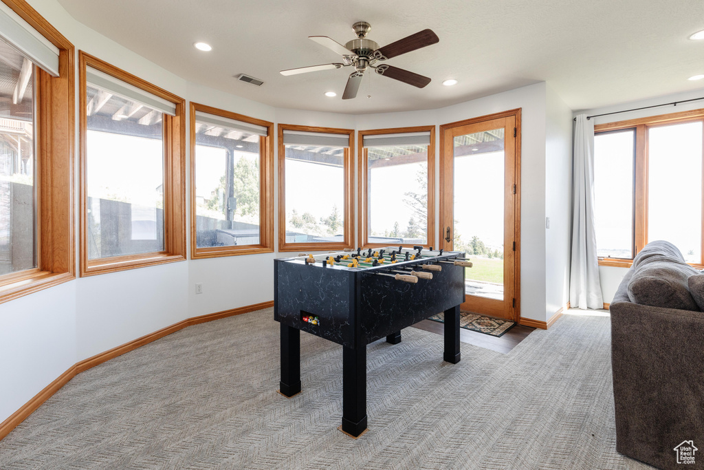 Game room with baseboards, light colored carpet, recessed lighting, and a ceiling fan