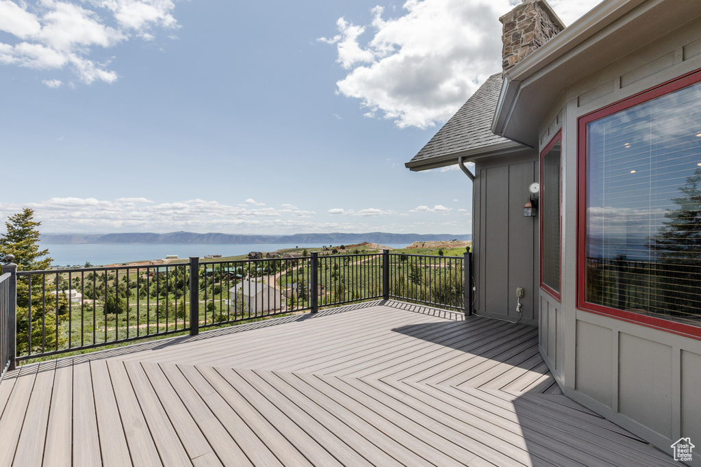 Wooden terrace with a water and mountain view