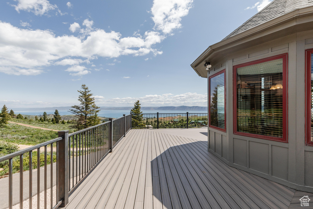 Wooden deck featuring a water view