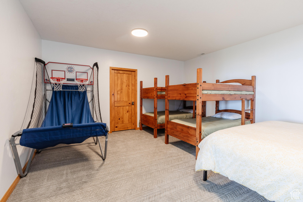 Bedroom with carpet and baseboards