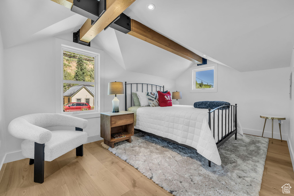 Bedroom featuring light wood-type flooring, multiple windows, recessed lighting, and baseboards