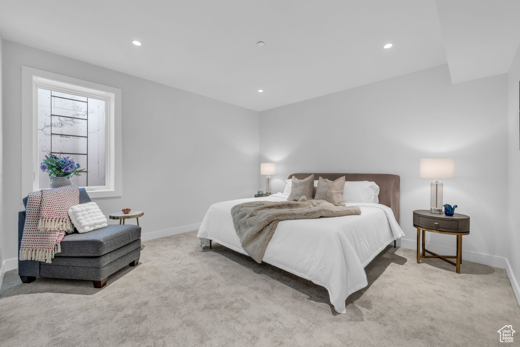 Bedroom with carpet flooring, baseboards, and recessed lighting