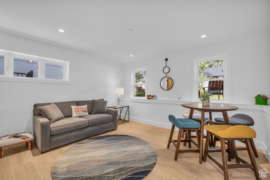 Living room featuring light wood-style floors and recessed lighting