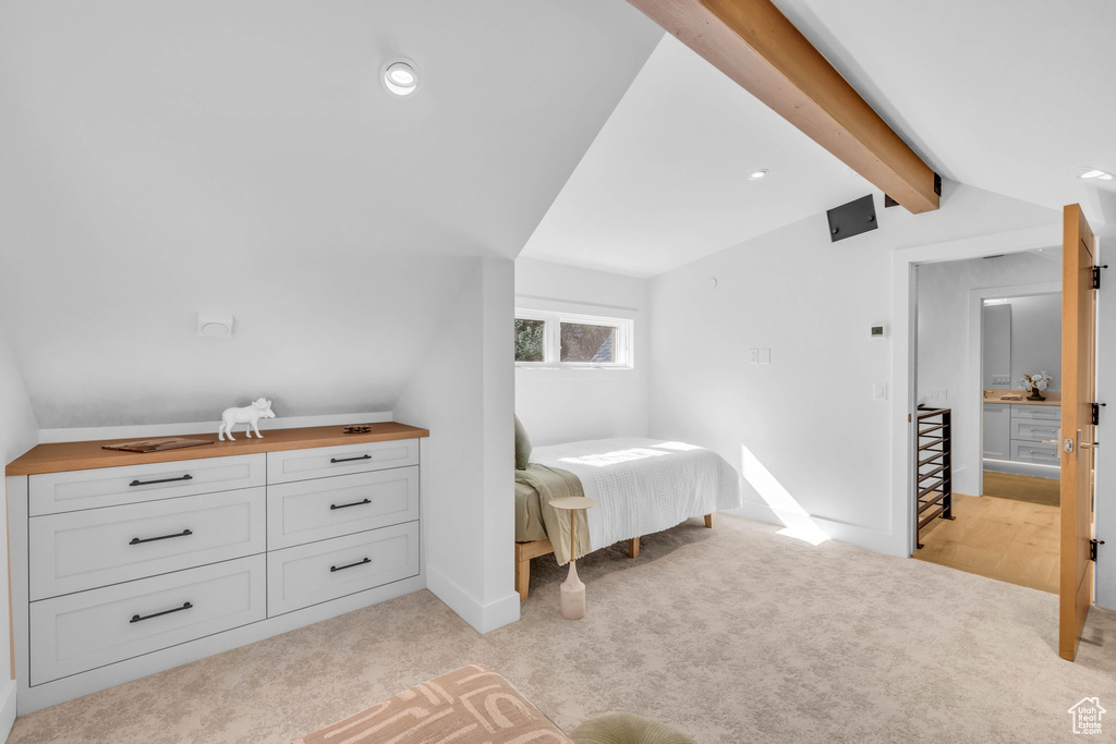 Bedroom with light colored carpet, baseboards, and recessed lighting