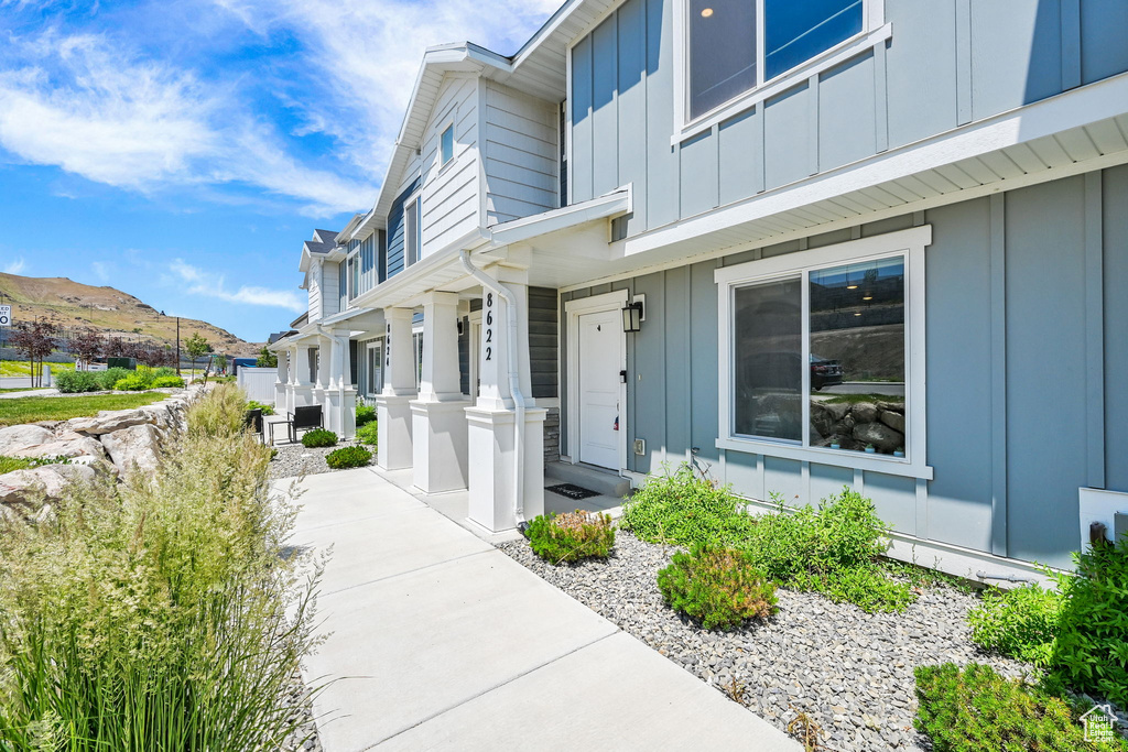 Doorway to property featuring board and batten siding