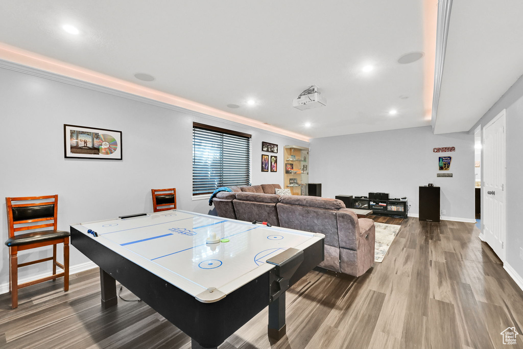 Playroom featuring wood finished floors, recessed lighting, and baseboards
