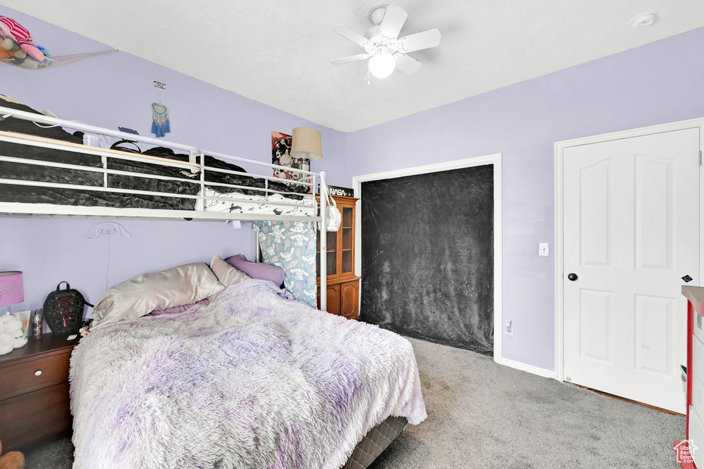 Bedroom featuring carpet, a ceiling fan, a closet, and baseboards