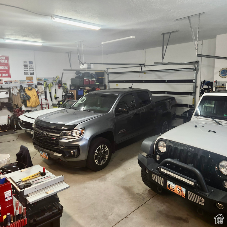 Garage featuring a garage door opener