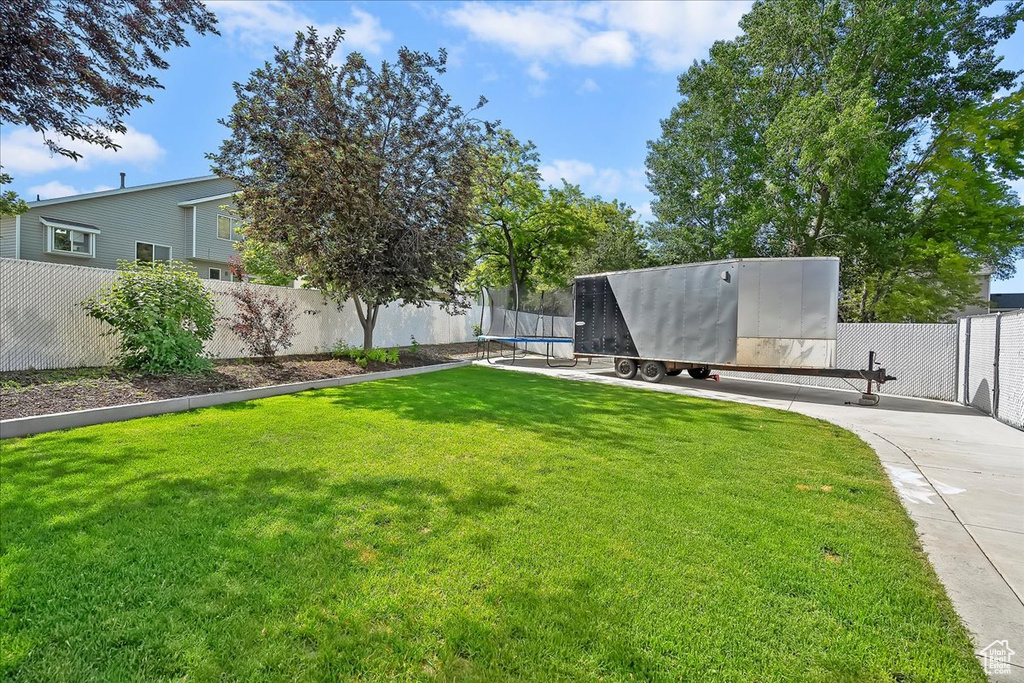View of yard featuring a trampoline