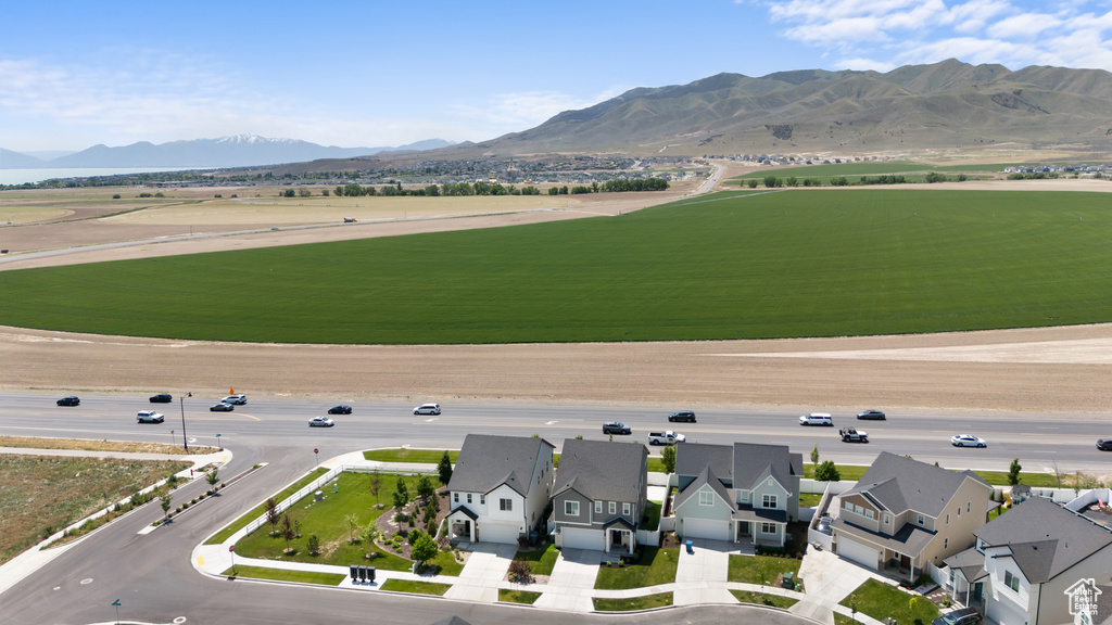 View of mountain backdrop featuring nearby suburban area
