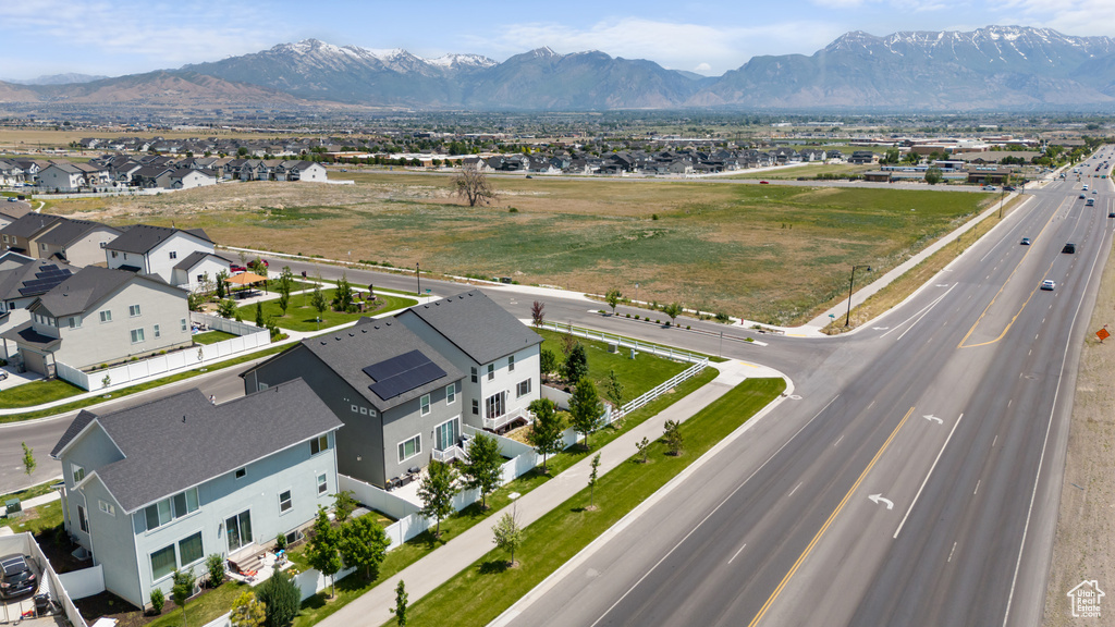 Aerial perspective of suburban area featuring a mountain backdrop