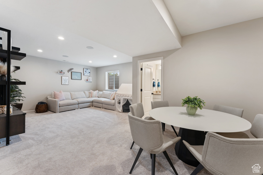 Dining room with recessed lighting and carpet floors