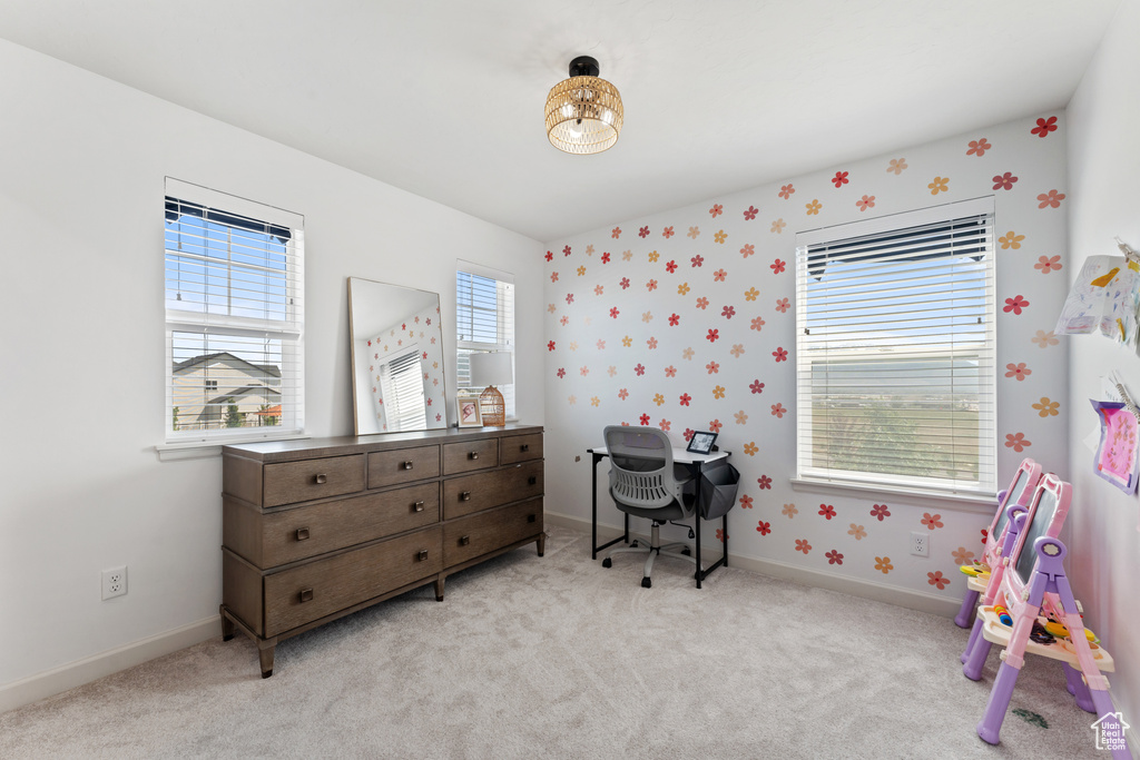 Bedroom with light carpet and baseboards
