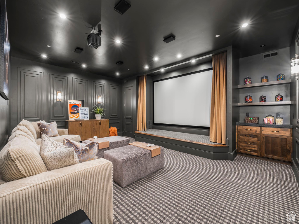 Carpeted home theater featuring recessed lighting
