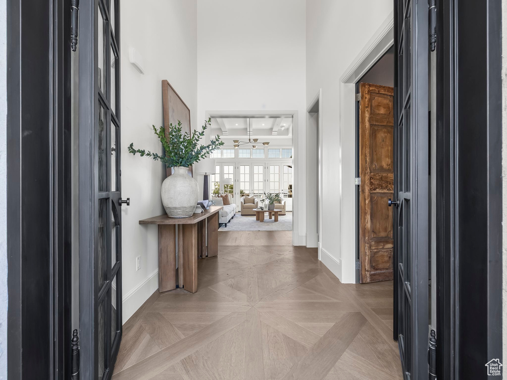 Foyer entrance featuring baseboards and a high ceiling