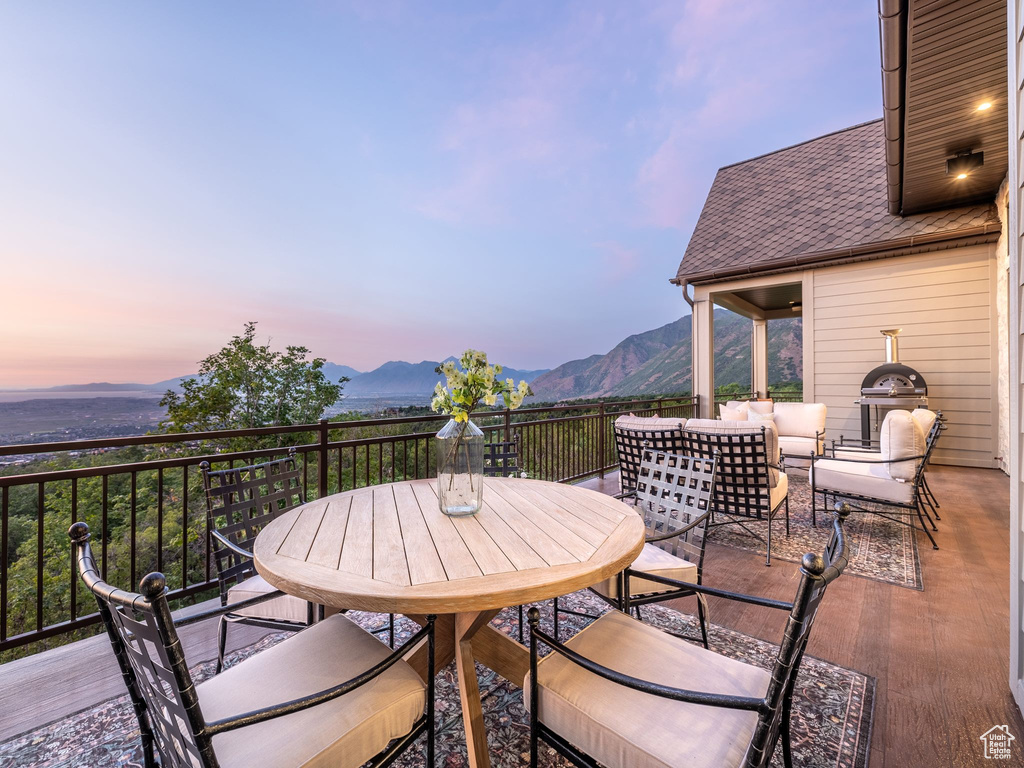 View of patio / terrace featuring a mountain view and outdoor dining area