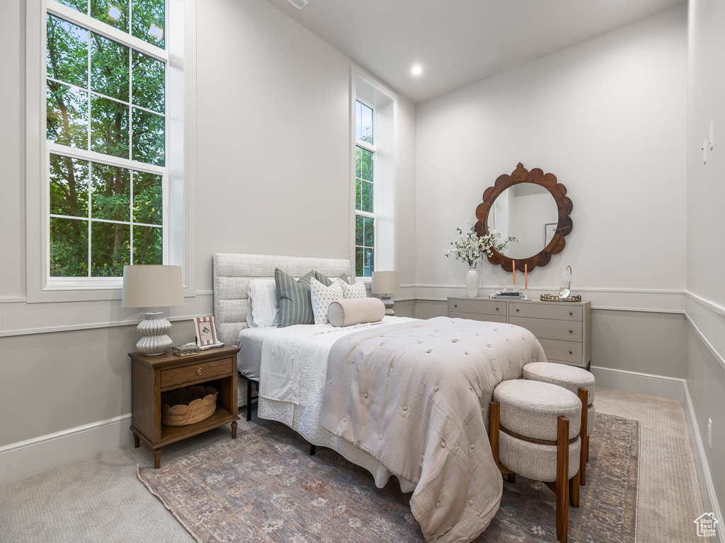 Carpeted bedroom with baseboards
