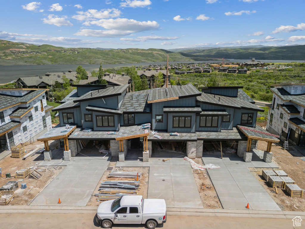 View from above of property with a mountain backdrop