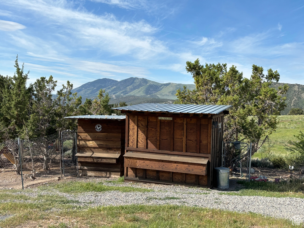 View of poultry coop with a mountain view