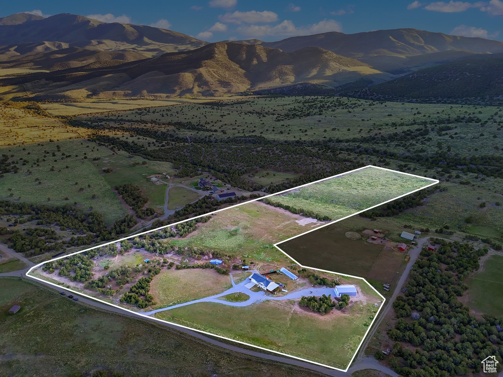 View of rural area featuring property parcel outlined and a mountainous background