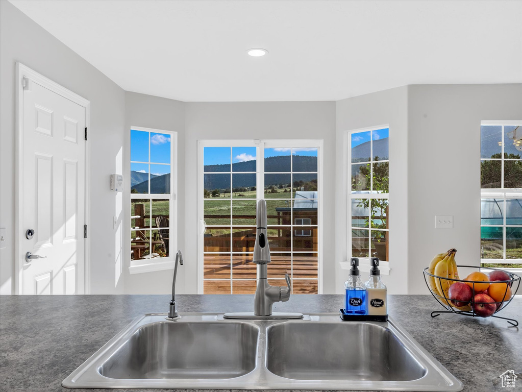 Kitchen featuring a sink, a mountain view, and recessed lighting