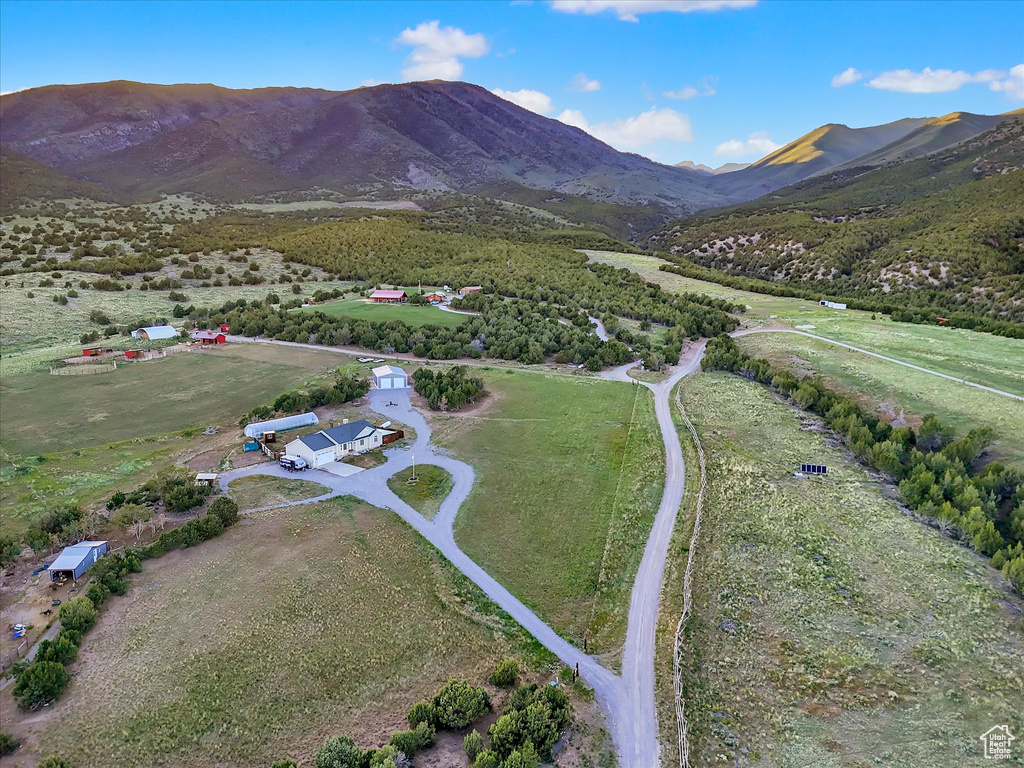 View of property location featuring a mountainous background and rural landscape