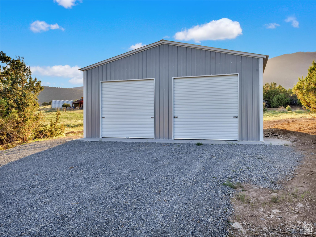 Detached garage featuring a mountain view