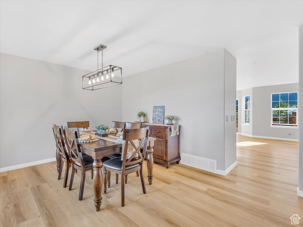 Dining room with light wood finished floors and baseboards