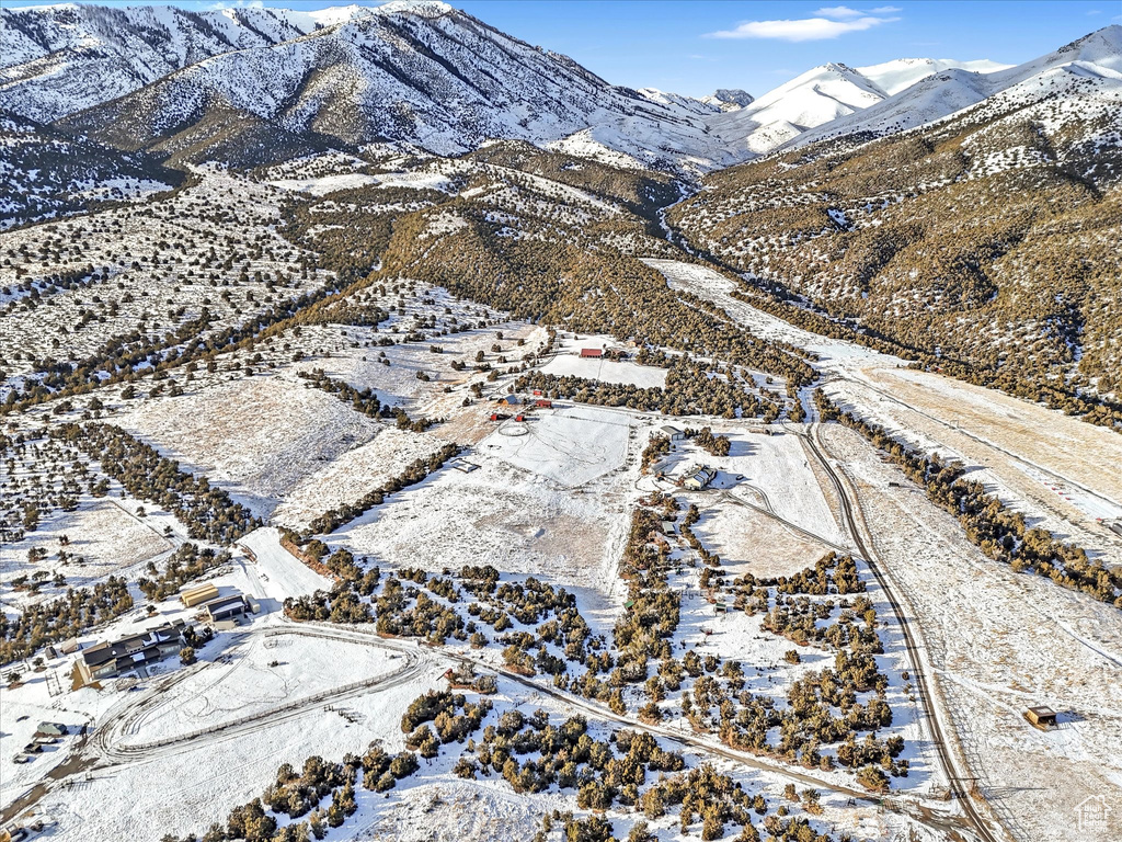 Snowy aerial view with a mountain view