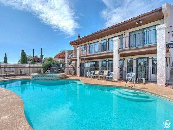 Community pool with a patio area