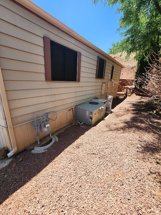 View of home's exterior featuring central AC unit