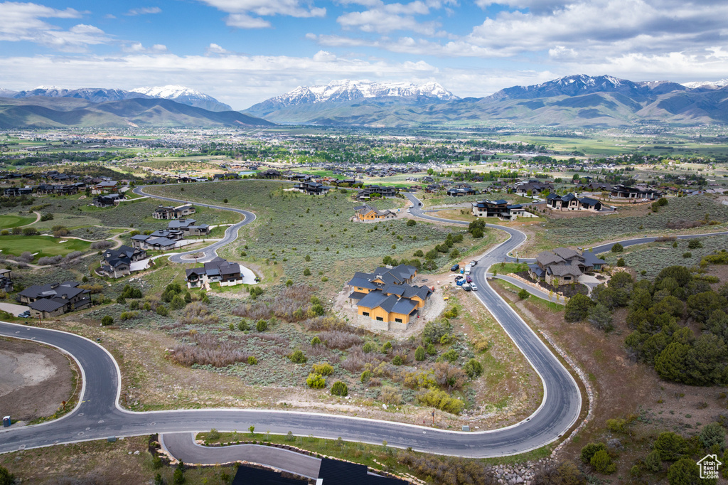 View of property location featuring a mountainous background and nearby suburban area