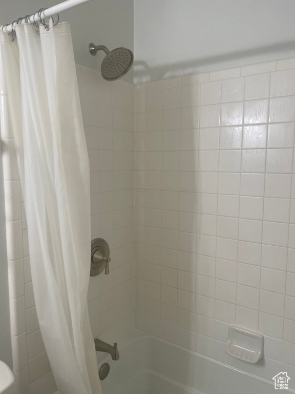 Full bath featuring shower / bath combo