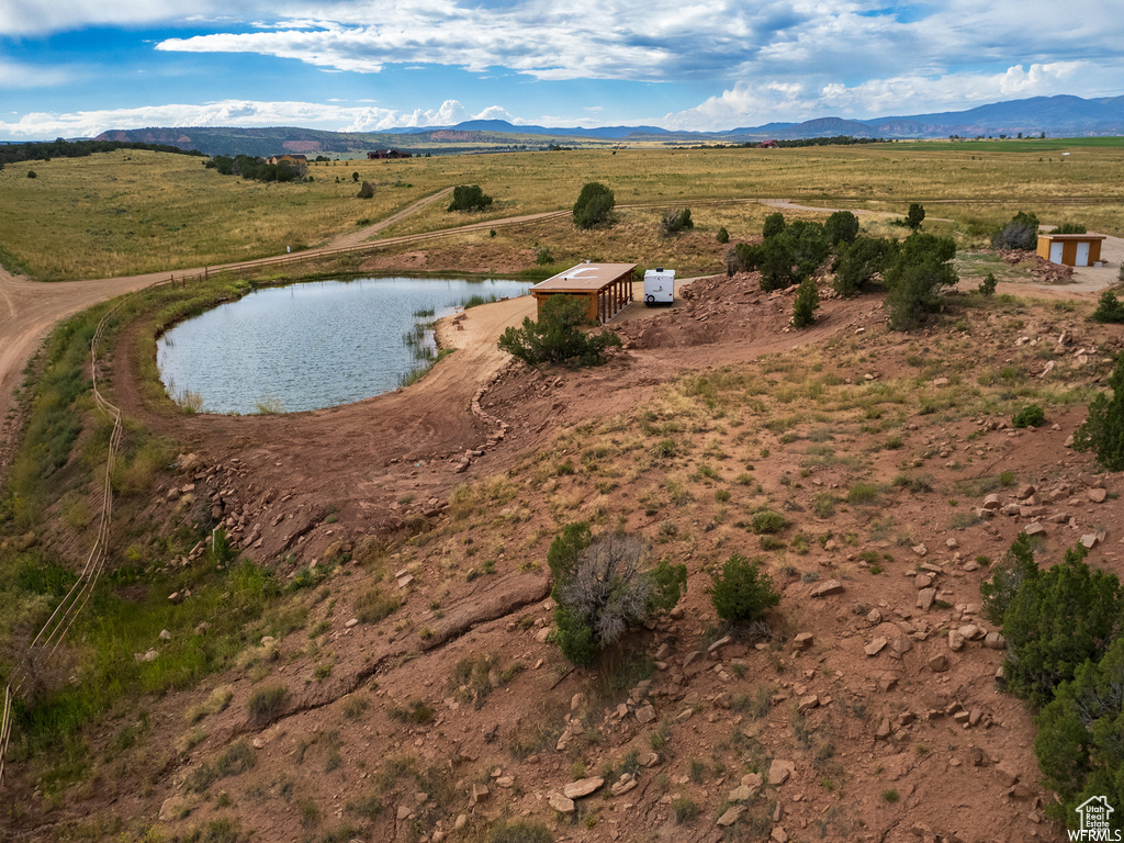 Overview of rural landscape featuring a water and mountain view