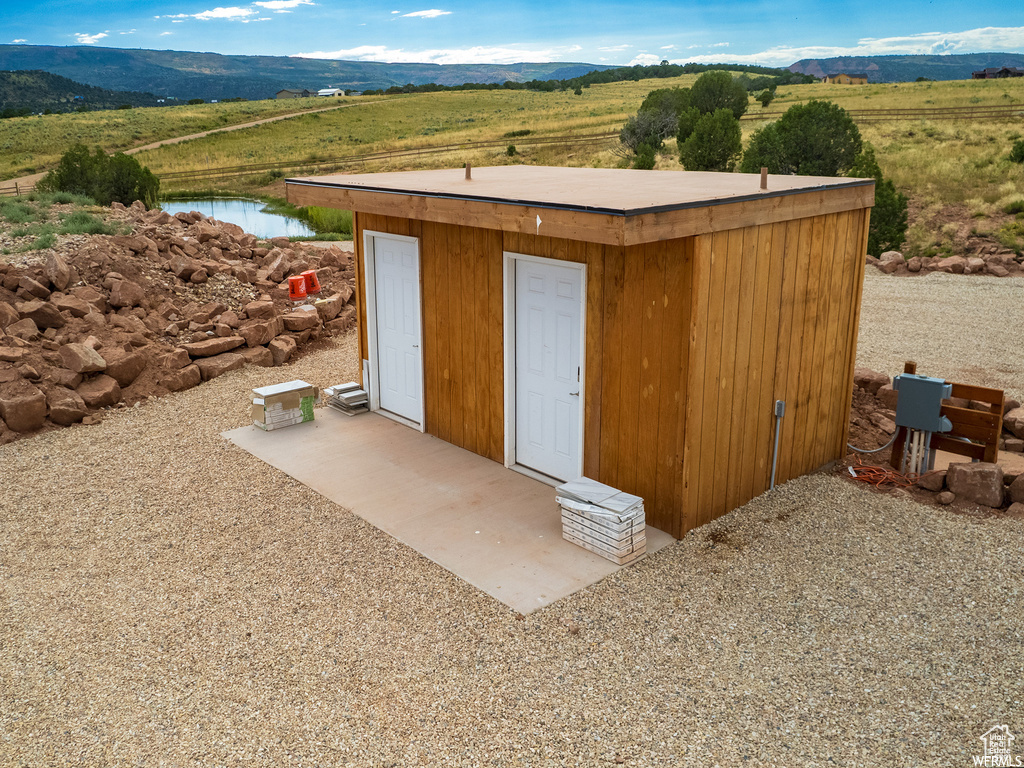 View of outbuilding with a mountain view
