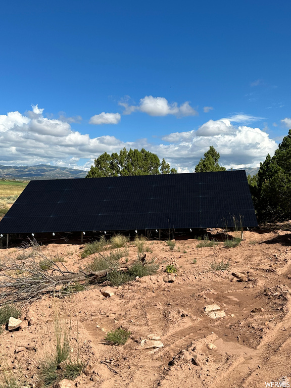 View of home\\\\\\\'s exterior featuring ground mounted solar panels