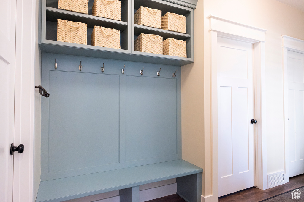 Mudroom with dark wood-style floors
