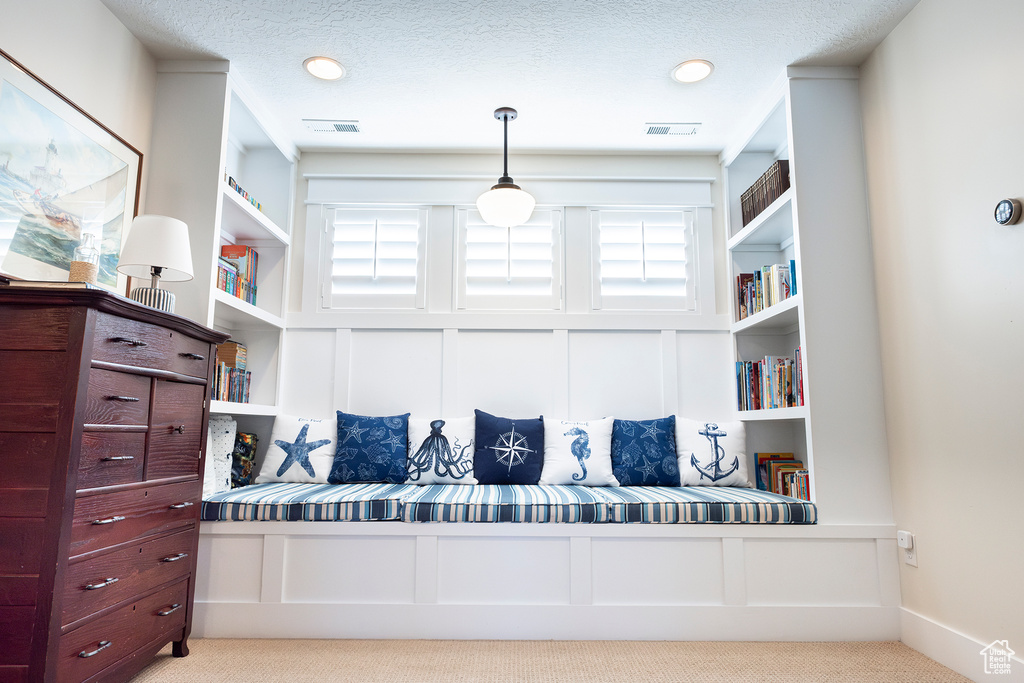 Sitting room featuring carpet floors