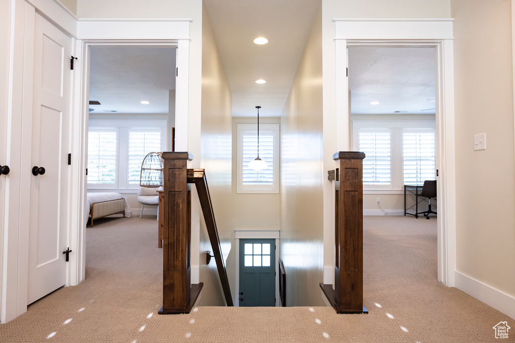Stairs with carpet floors, baseboards, healthy amount of natural light, and recessed lighting