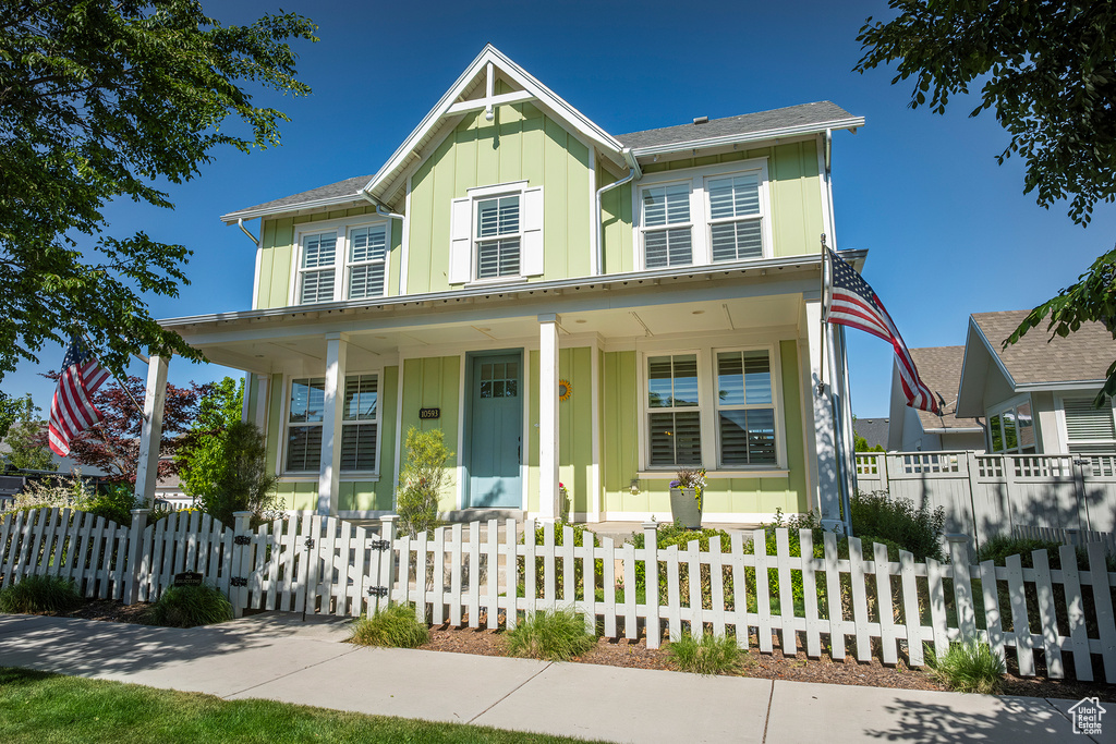 View of front of property featuring a porch and board and batten siding