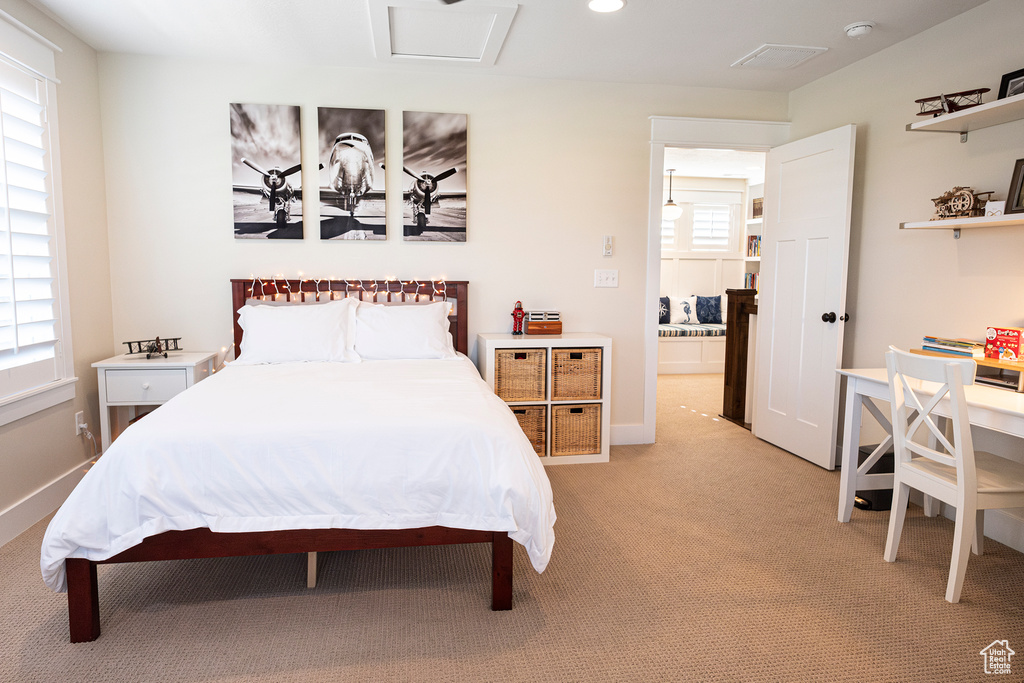 Bedroom featuring light carpet, recessed lighting, and baseboards