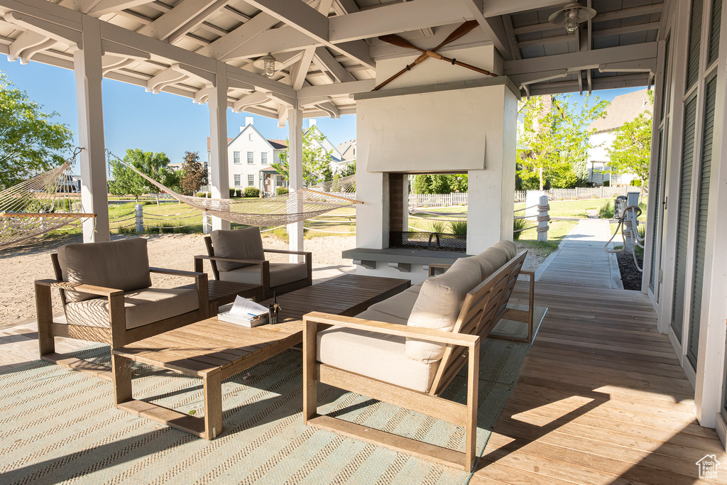 Wooden deck featuring an outdoor living space