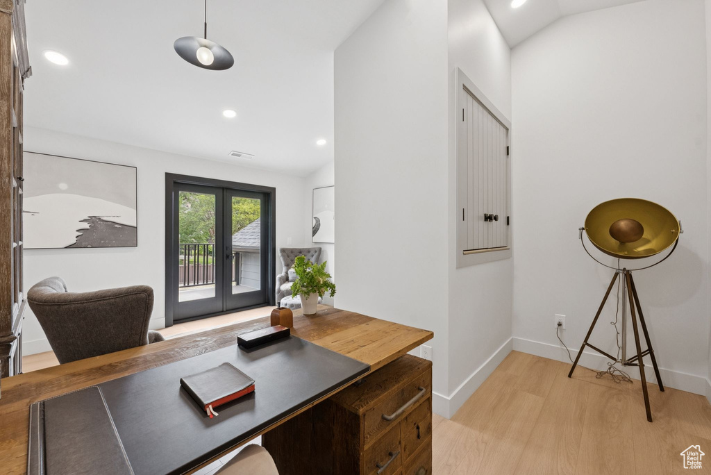 Office with light wood-style flooring, french doors, recessed lighting, and vaulted ceiling