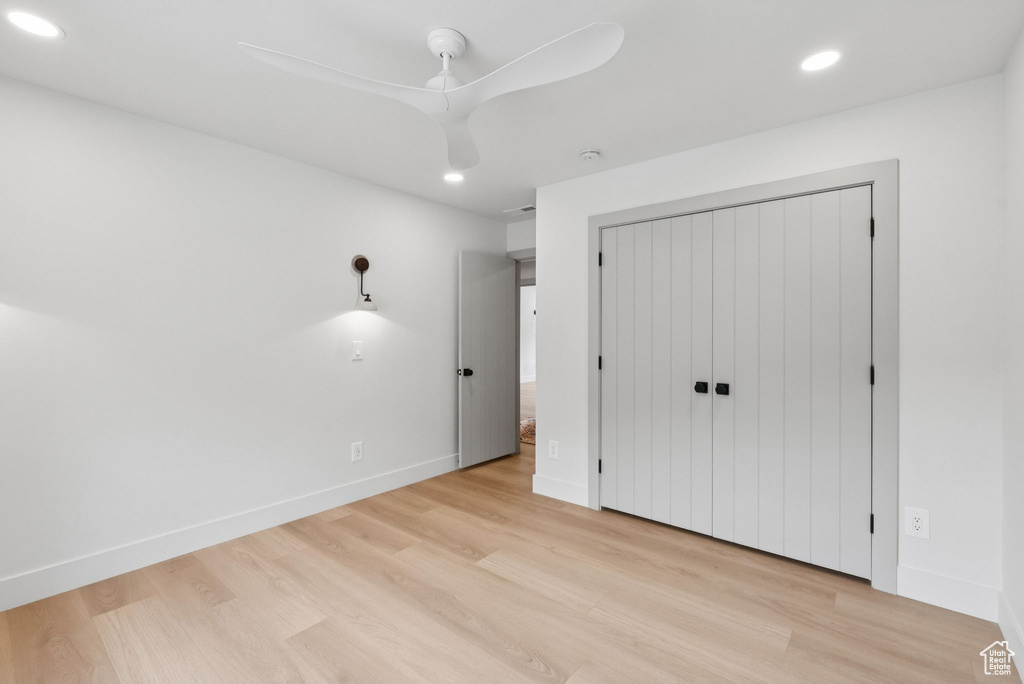 Unfurnished bedroom with recessed lighting, light wood-style floors, a closet, and ceiling fan