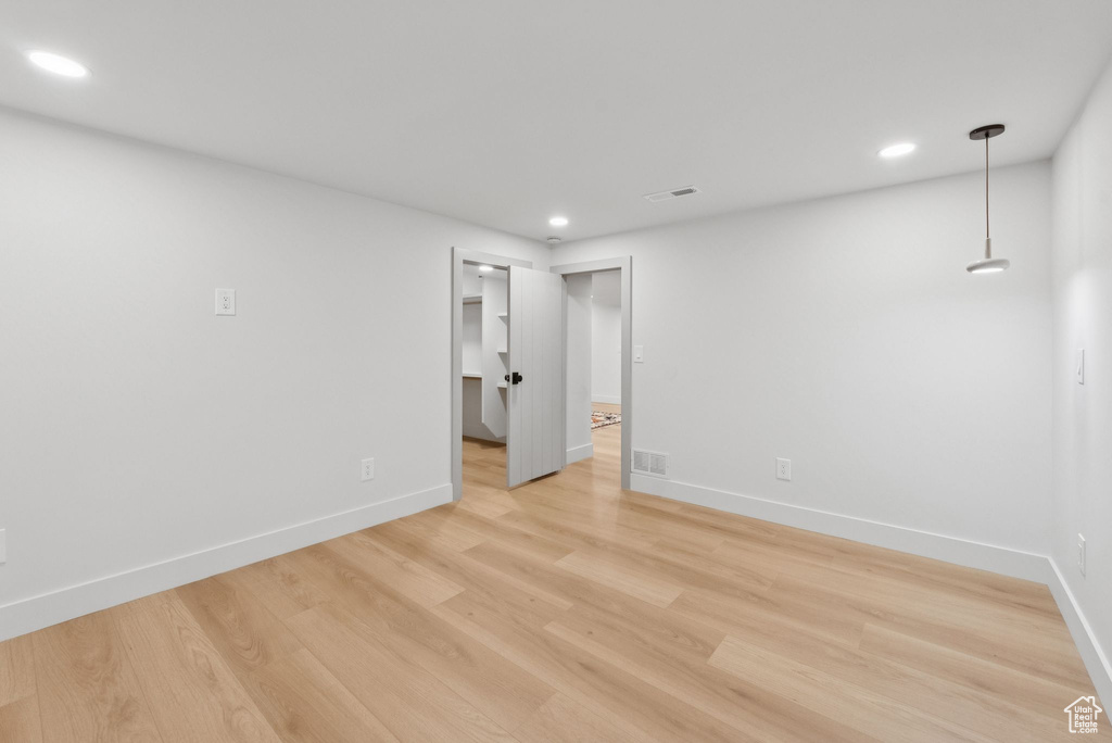 Empty room featuring recessed lighting and light wood finished floors