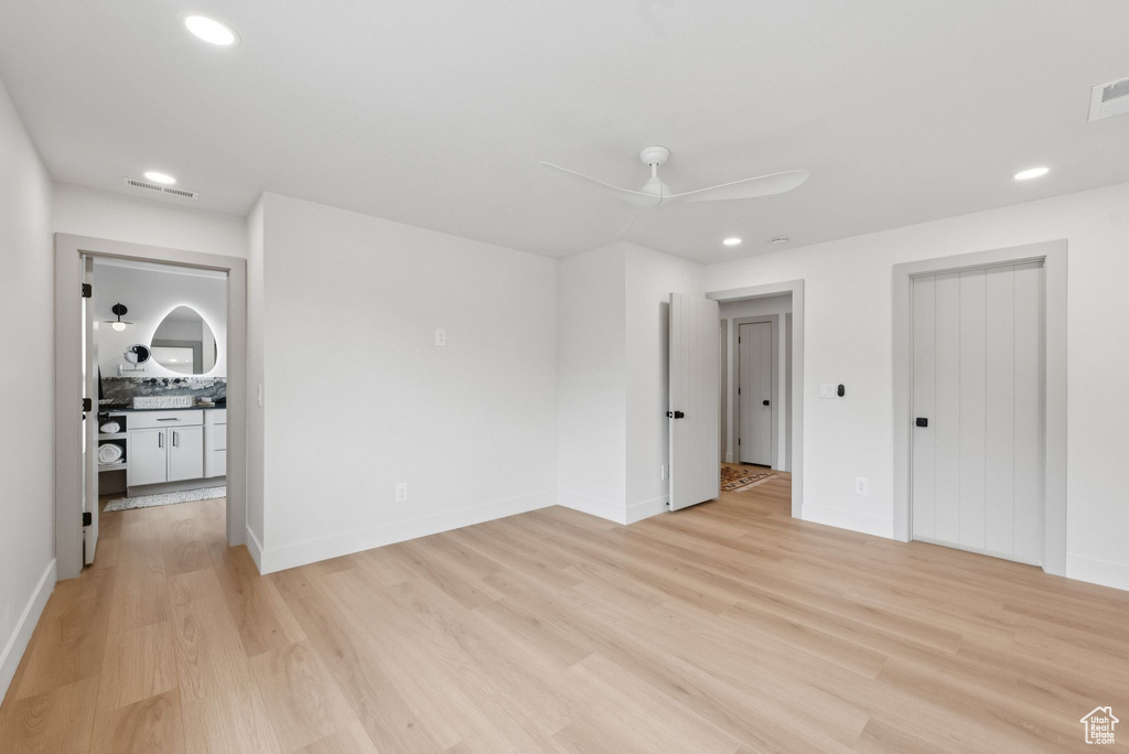 Spare room with light wood-type flooring, recessed lighting, and a ceiling fan