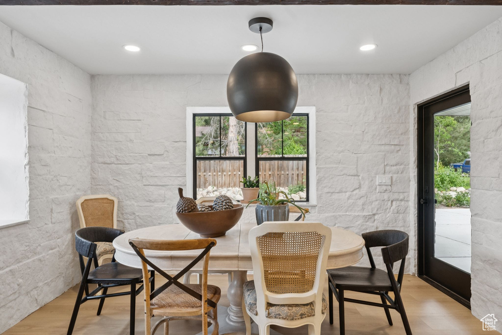 Dining area with light wood-style flooring