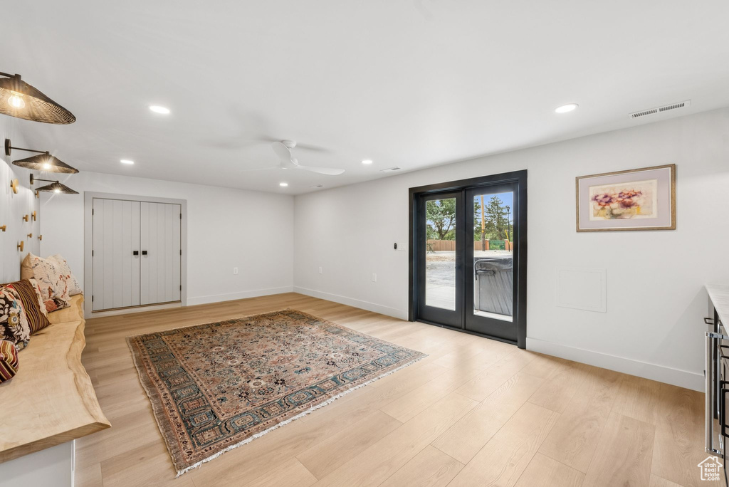 Living area featuring a ceiling fan, light wood-type flooring, and recessed lighting